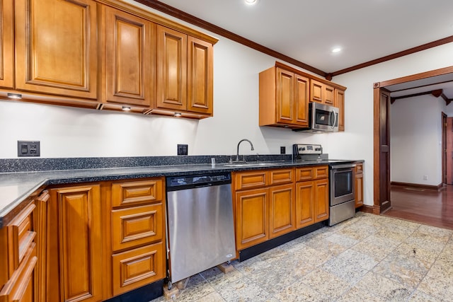 kitchen with sink, appliances with stainless steel finishes, and crown molding