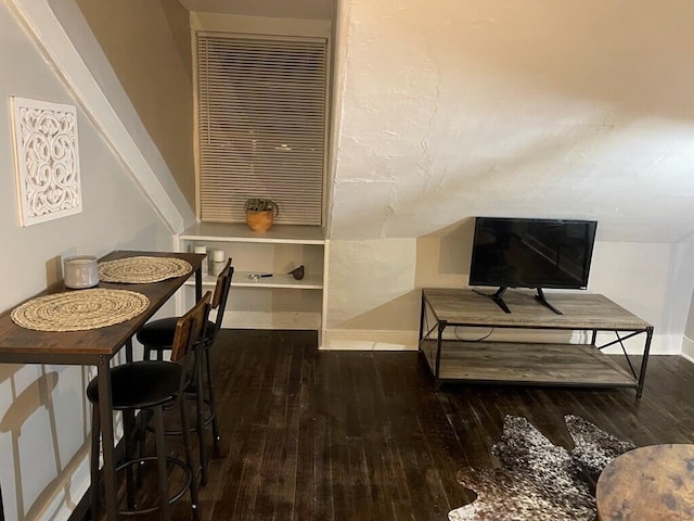 dining space with dark wood-type flooring