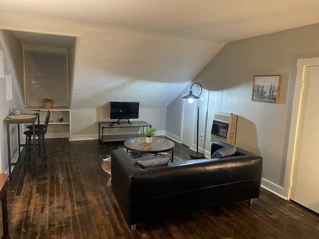 living room with dark wood-type flooring, lofted ceiling, and heating unit