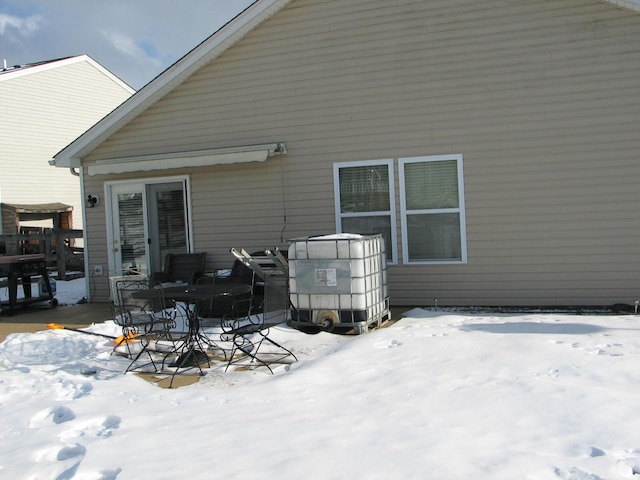 view of snow covered house