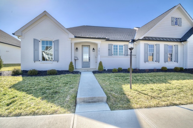 view of front of home with a front lawn