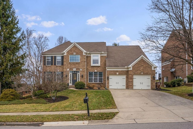 colonial inspired home featuring a garage, brick siding, concrete driveway, roof with shingles, and a front yard