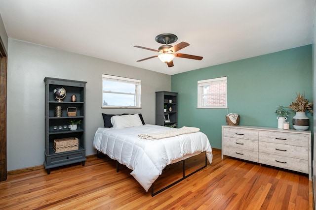 bedroom featuring ceiling fan and light hardwood / wood-style flooring