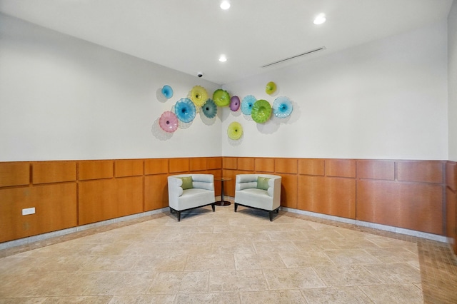 400 Riverboat Row Unit 605, Newport, KY 41071 - unfurnished room featuring wainscoting, recessed lighting, and light stone finish floors