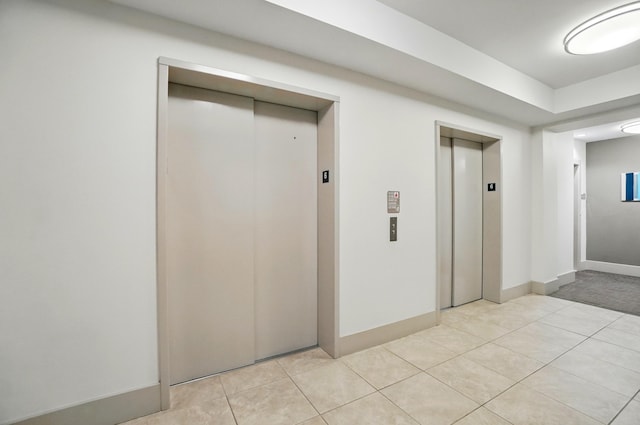 400 Riverboat Row Unit 605, Newport, KY 41071 - corridor with elevator, light tile patterned flooring, and baseboards