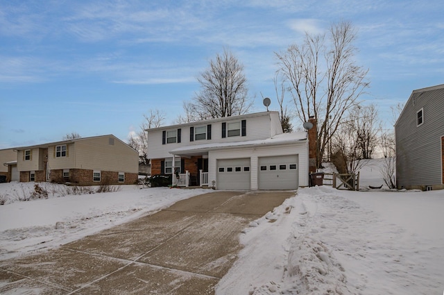 front of property with a garage