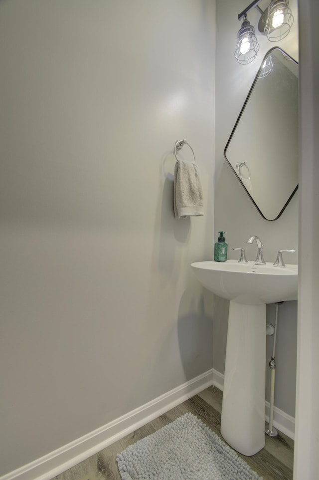 bathroom featuring sink and hardwood / wood-style floors