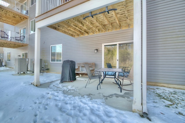 view of patio with a balcony, area for grilling, and central AC