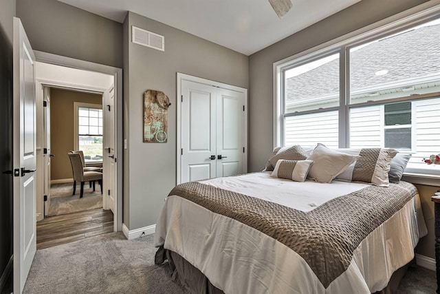 carpeted bedroom featuring a closet