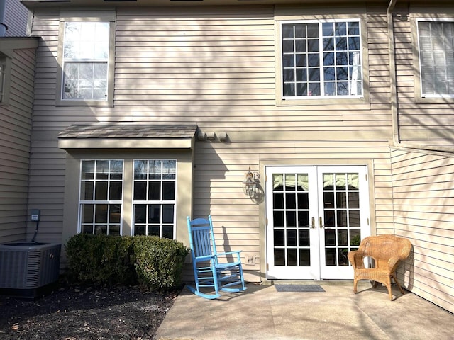 back of house featuring a patio, central AC, and french doors