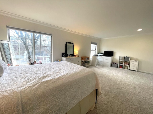 bedroom with ornamental molding and carpet floors