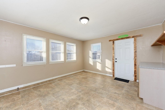 spare room featuring a healthy amount of sunlight