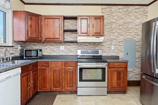 kitchen with sink, ornamental molding, and stainless steel appliances