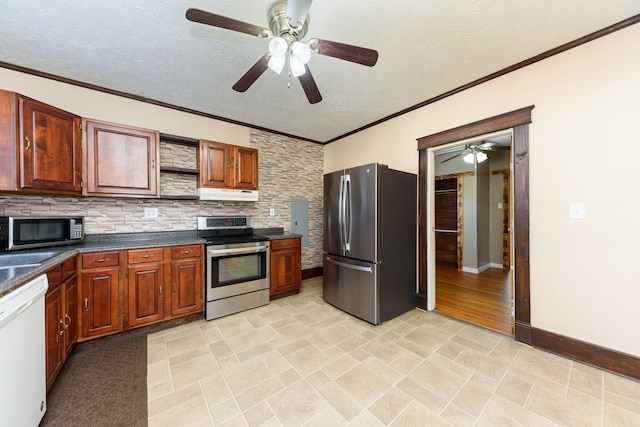 kitchen featuring ceiling fan, a textured ceiling, appliances with stainless steel finishes, and tasteful backsplash