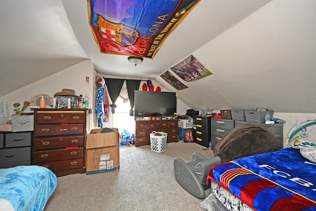 carpeted bedroom featuring lofted ceiling