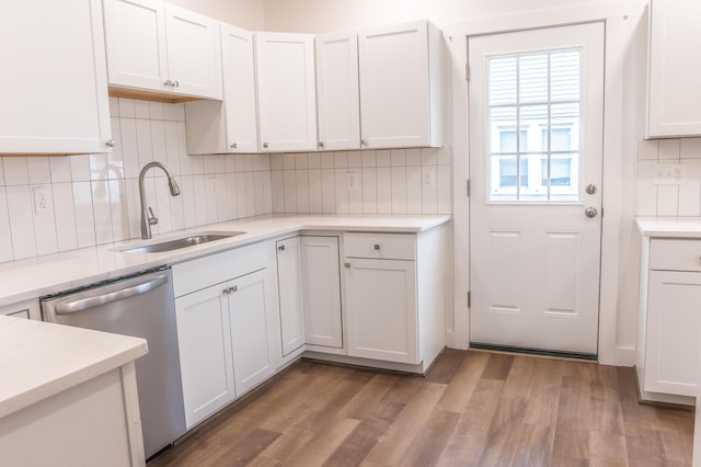 kitchen featuring sink, light hardwood / wood-style flooring, dishwasher, and white cabinets