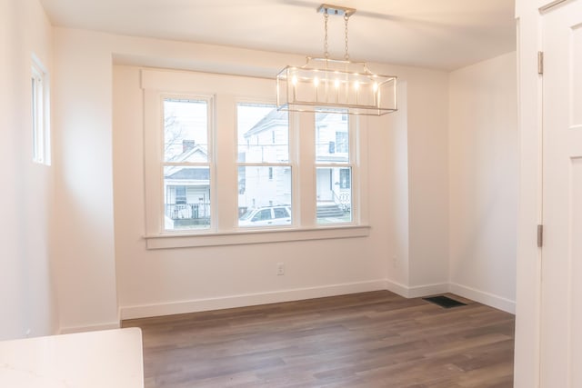 unfurnished dining area with hardwood / wood-style flooring