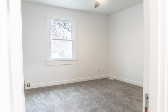 unfurnished room with ceiling fan and carpet flooring