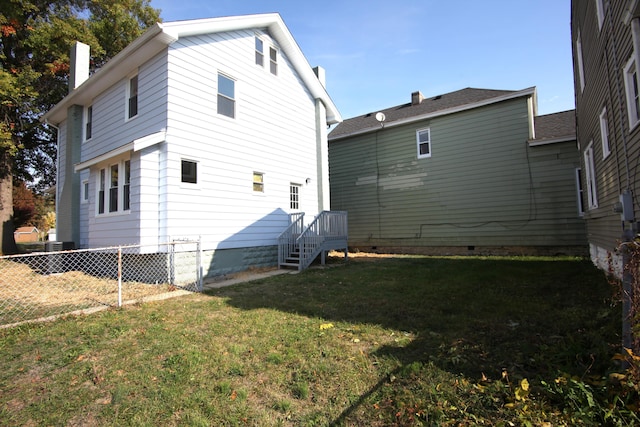 rear view of house with a lawn