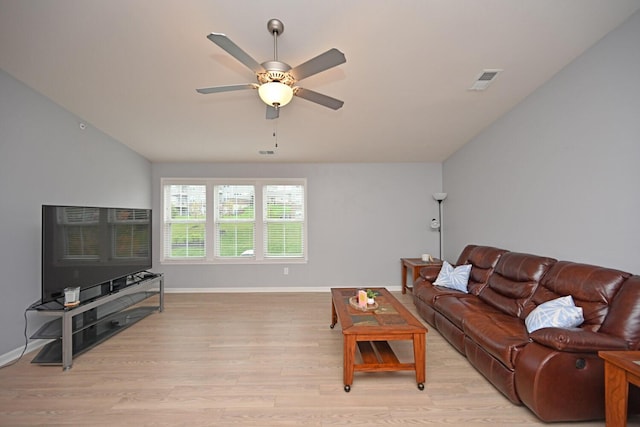 living room featuring light hardwood / wood-style floors and ceiling fan