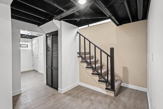 stairway featuring hardwood / wood-style floors