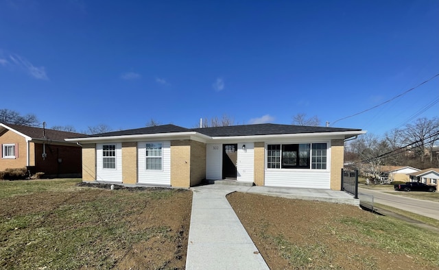 single story home featuring a patio area and a front yard