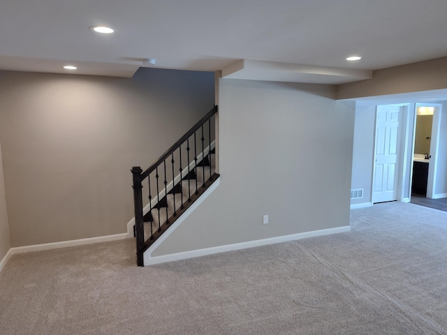 basement featuring carpet flooring