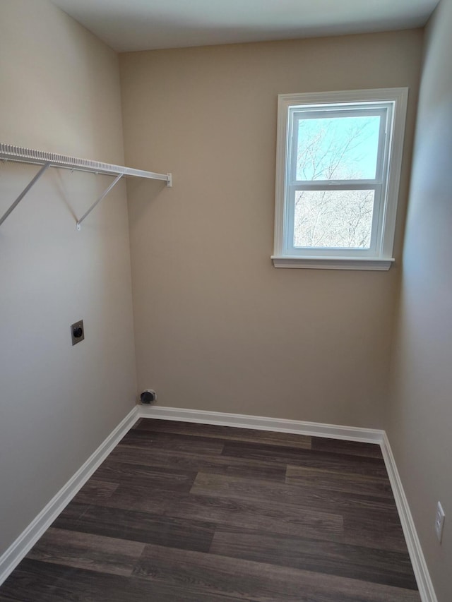 clothes washing area with dark hardwood / wood-style floors and hookup for an electric dryer