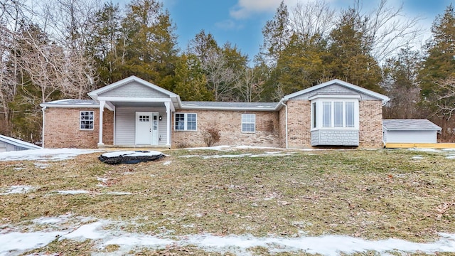 view of front of house featuring a porch and a yard