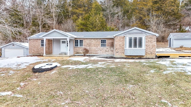 view of front of property with a garage and an outdoor structure