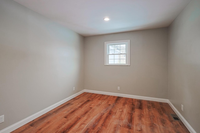 empty room featuring wood-type flooring