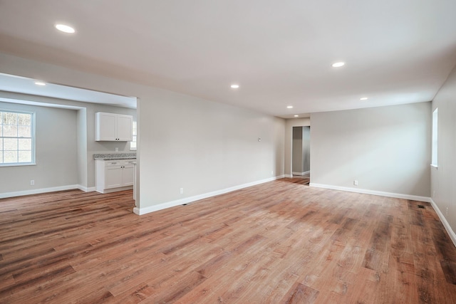 unfurnished room with light hardwood / wood-style floors