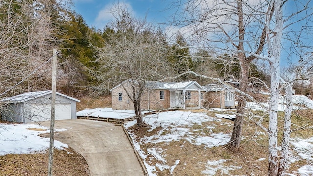 ranch-style home with an outbuilding and a garage