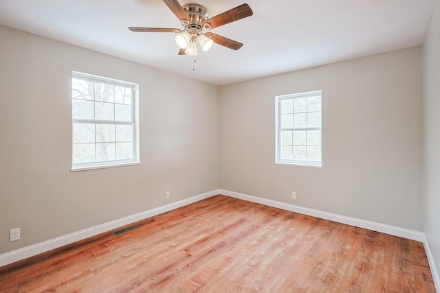 spare room with ceiling fan and light hardwood / wood-style floors