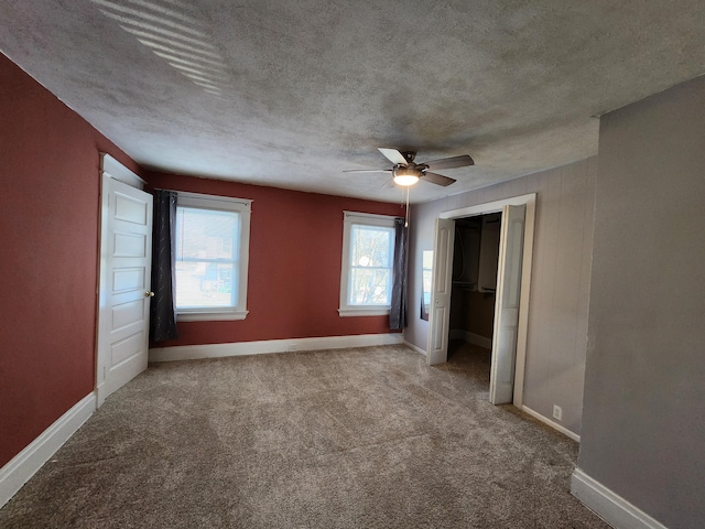 unfurnished bedroom featuring a closet, ceiling fan, and carpet flooring