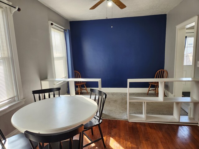 dining room with wood-type flooring and ceiling fan