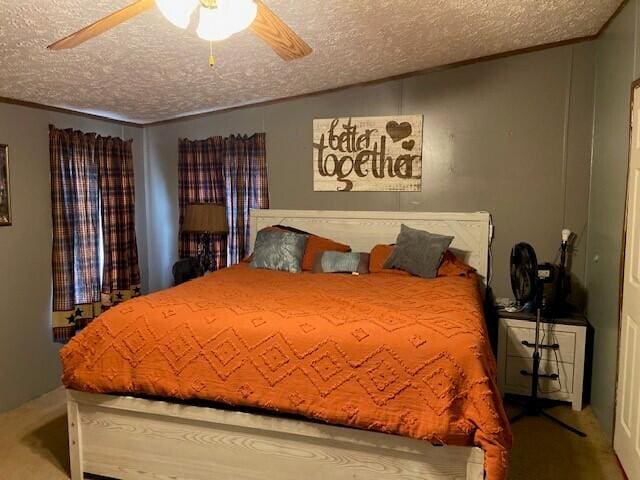 carpeted bedroom with a textured ceiling and ceiling fan