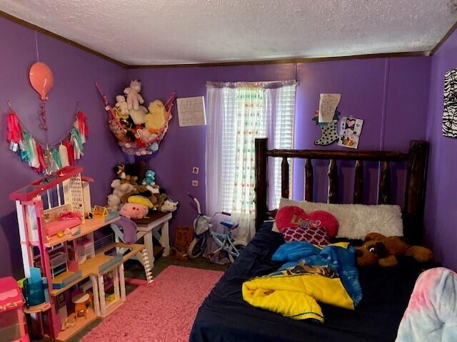 bedroom featuring a textured ceiling