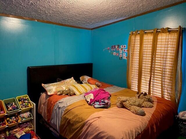 bedroom featuring a textured ceiling