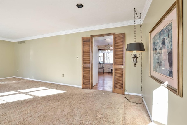 unfurnished room featuring carpet floors and ornamental molding