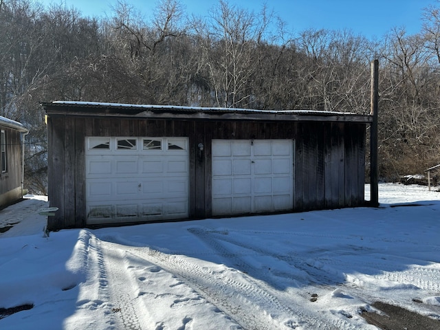 view of snow covered garage