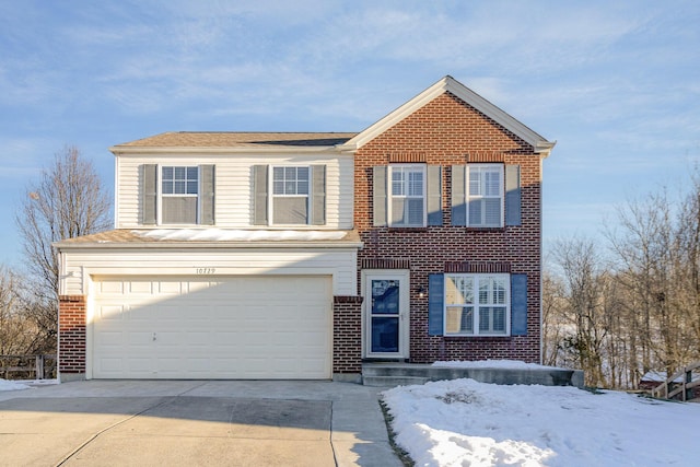 front of property with a garage