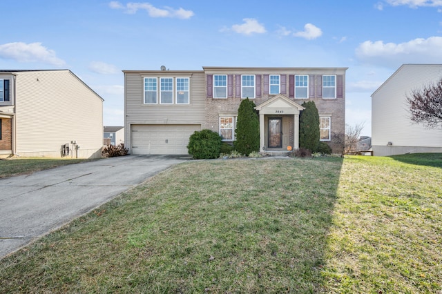 view of front of property featuring a garage and a front lawn