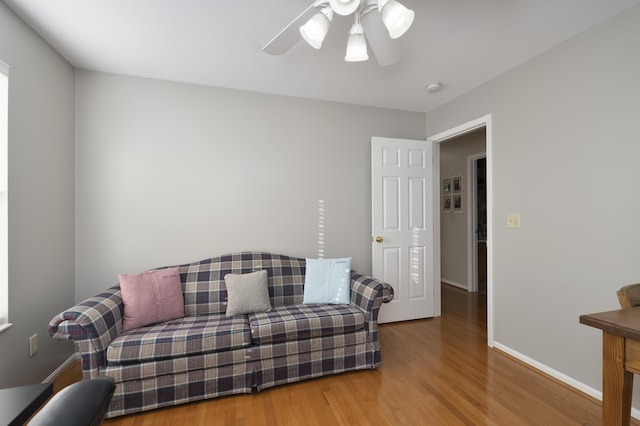 sitting room featuring ceiling fan and hardwood / wood-style floors