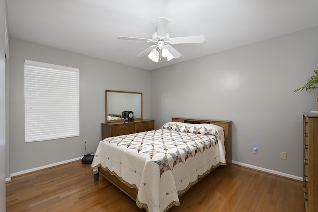 bedroom featuring ceiling fan and light hardwood / wood-style flooring