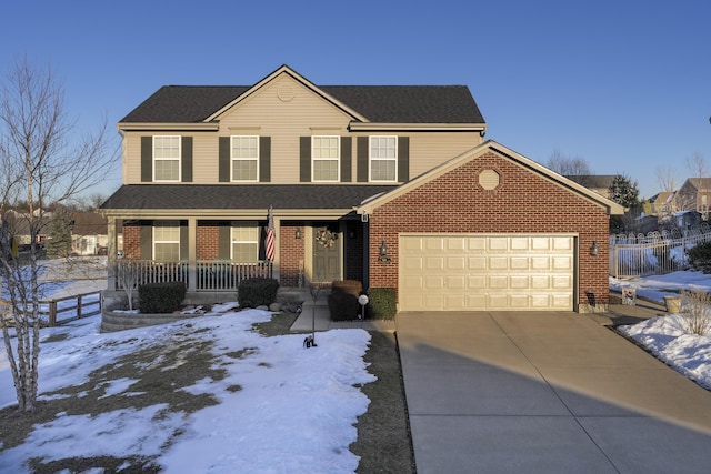 view of front property featuring a porch and a garage