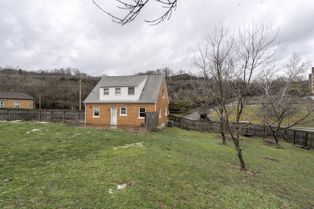 view of home's exterior with a lawn