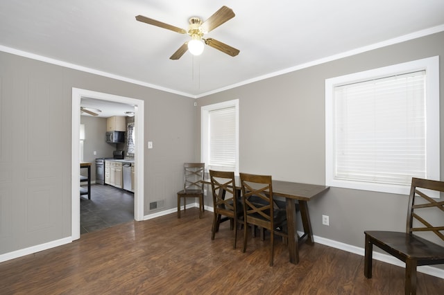 dining room featuring crown molding, dark wood-type flooring, and ceiling fan