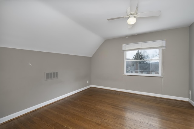 additional living space with dark wood-type flooring, ceiling fan, and vaulted ceiling