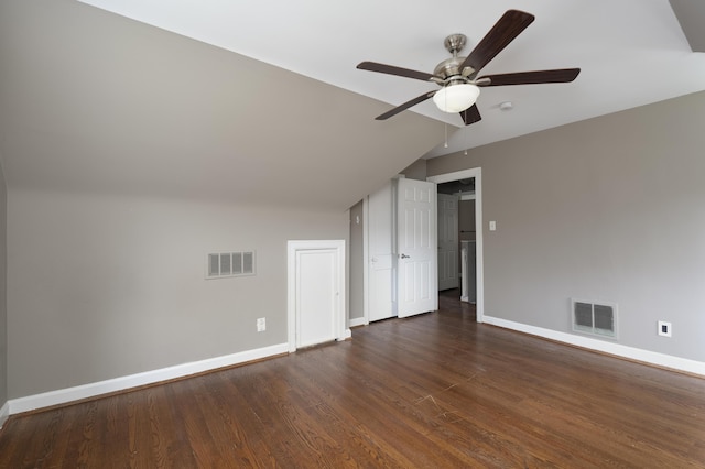 additional living space featuring vaulted ceiling, dark wood-type flooring, and ceiling fan